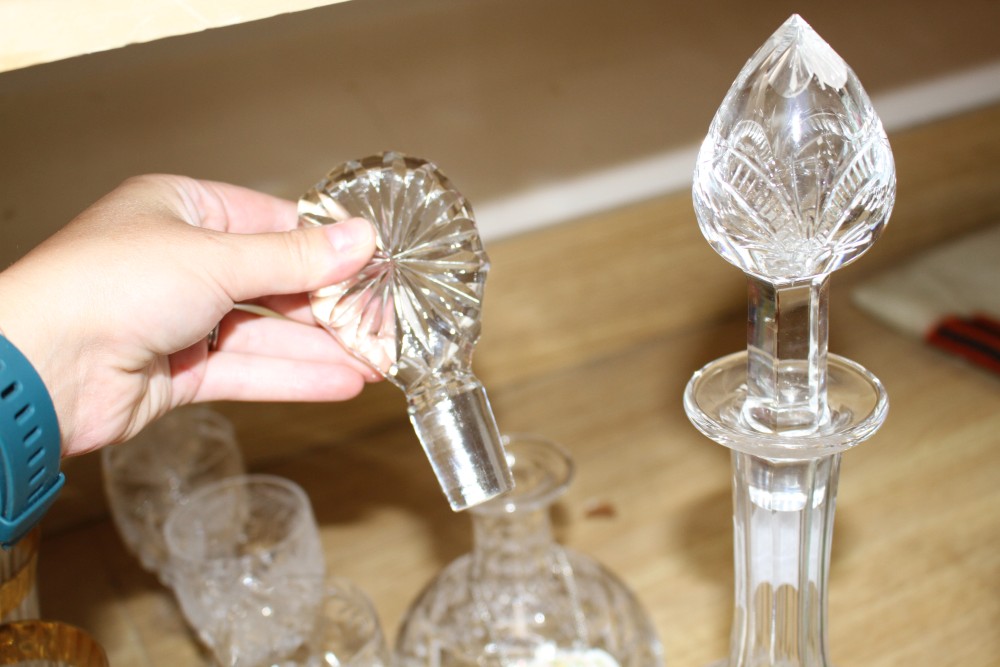 A pair of Stuart? cut glass decanters and stoppers, another decanter, a set of eight vineous etched wine glasses and a set of six Itali